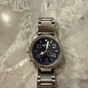 Nixon Silver Stainless Steel Watch with Blue Dial